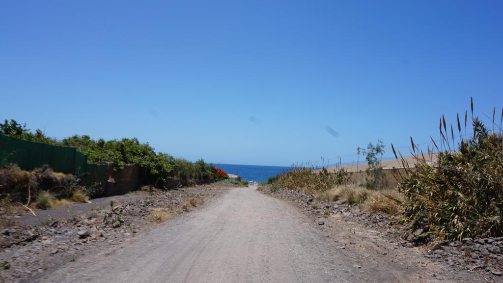 Road reaching the beach of Tasarte