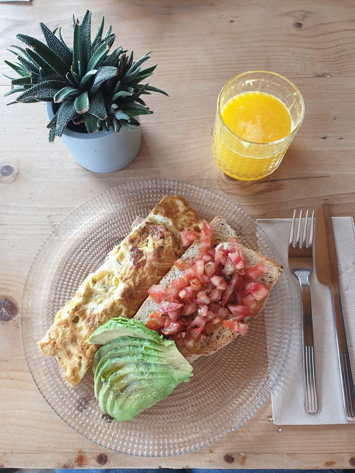 Omelette with homemade toast and avocado