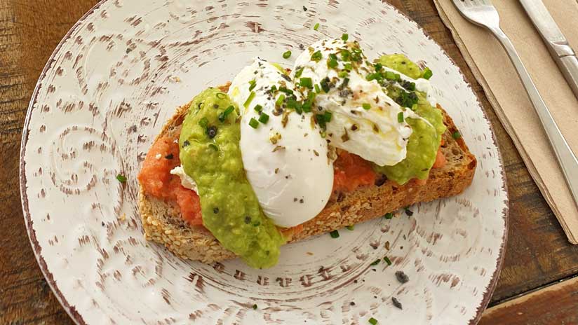 Poached eggs with avocado and tomato in Mr Kale
